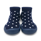 Pair of blue sock shoes with white polka dots.
