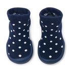 Two blue sock shoes with white dots.