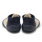 Back view of navy blue and tan baby shoes.