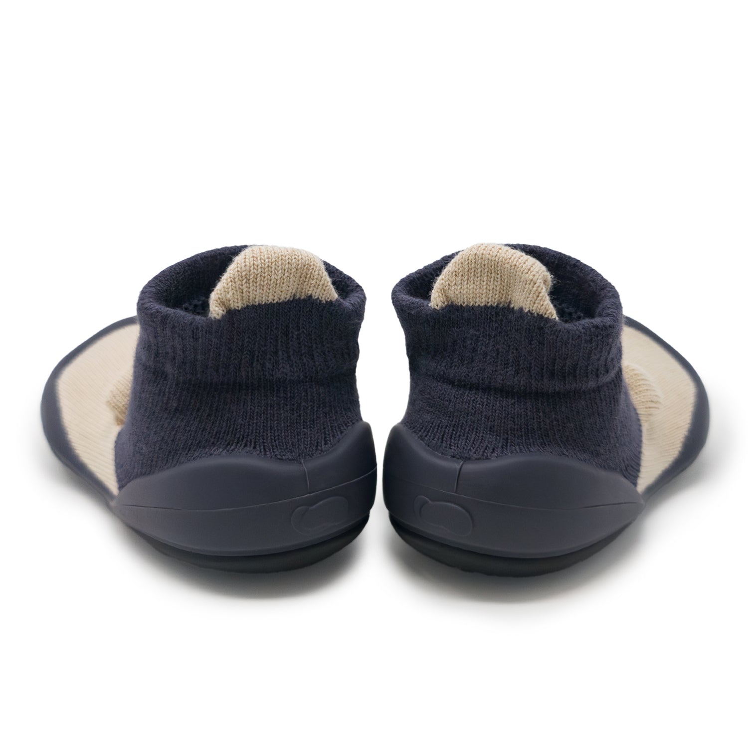 Back view of navy blue and tan baby shoes.
