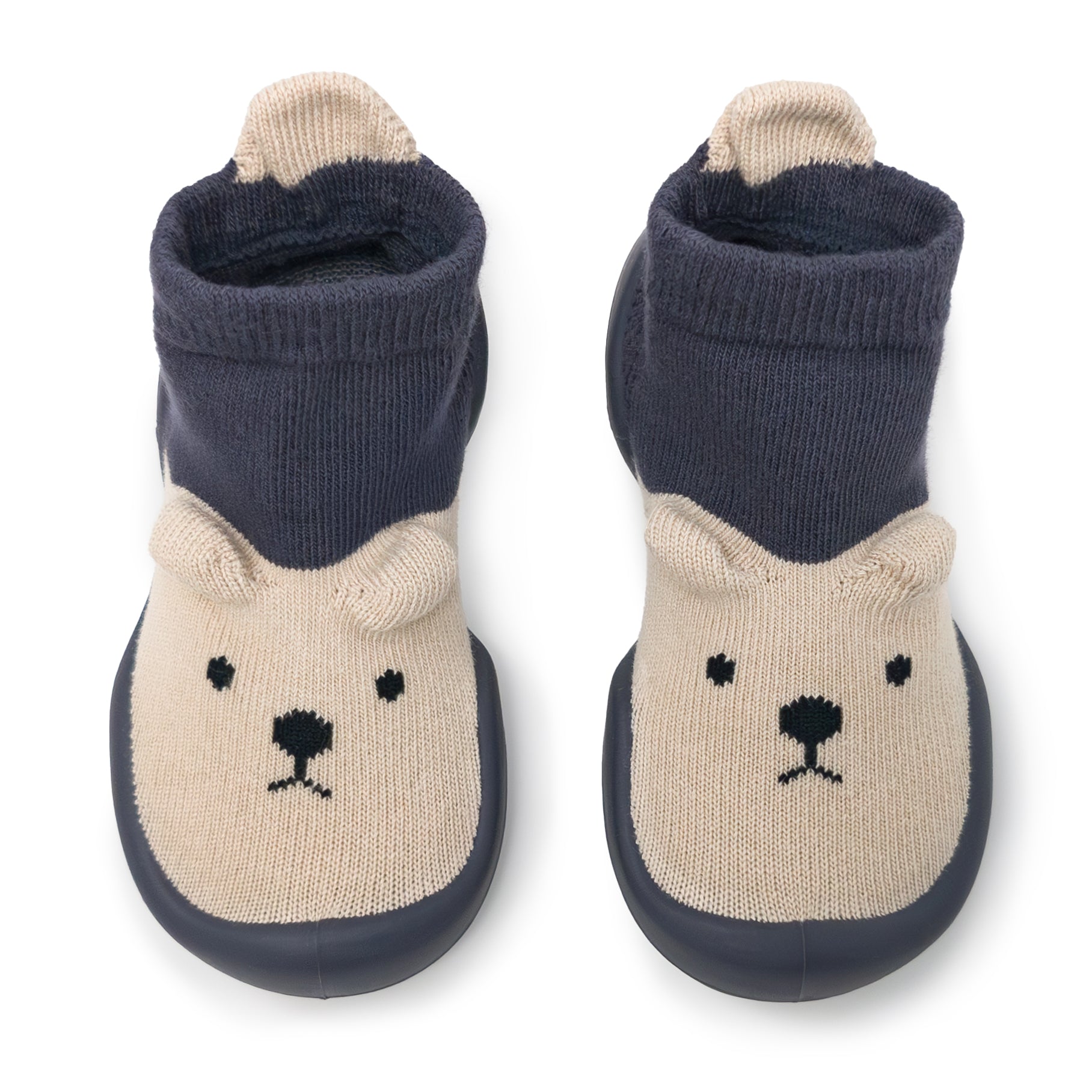 A pair of knitted baby shoes with bear designs.