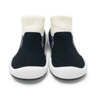 A pair of black and white toddler shoes.