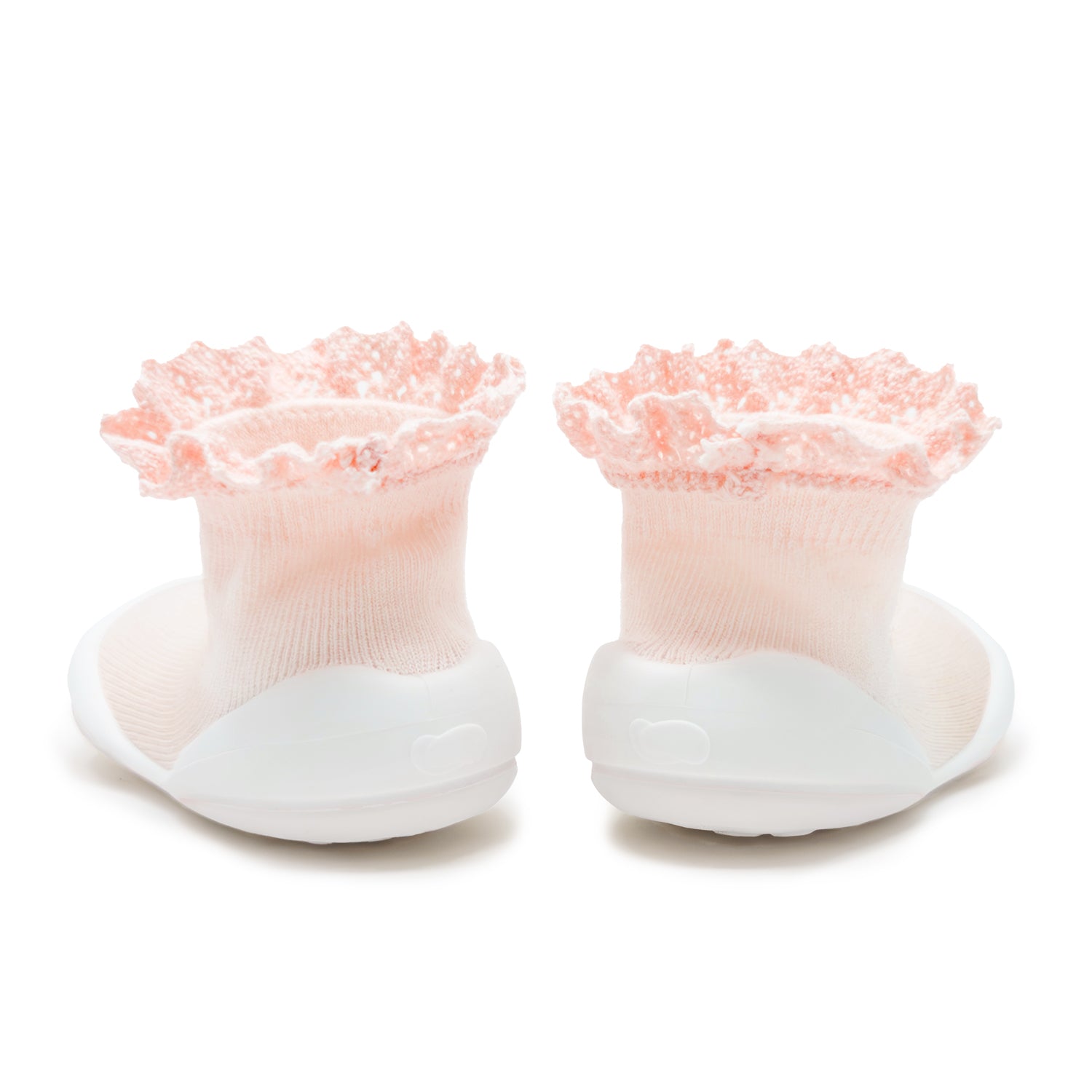 Pair of Lace Trim Baby Pink sock shoes with pink textured tops and white soles on a white background